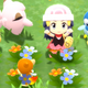 A Pokemon character surrounded by Pokemon in green grass with pretty little flowers.